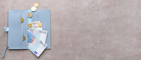 Wallet with money on grunge background with space for text