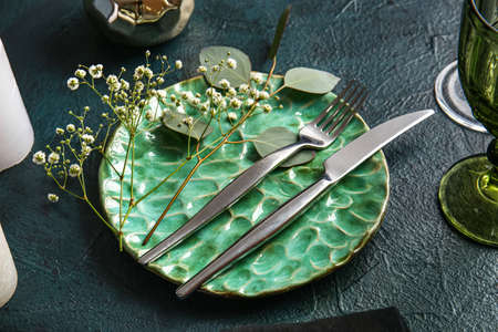 Beautiful table setting for wedding on black backgroundの写真素材