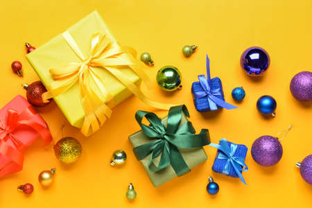 Christmas gifts and decor on color background. LGBT conceptの写真素材
