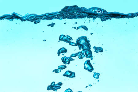 Clear water with air bubbles on blue background