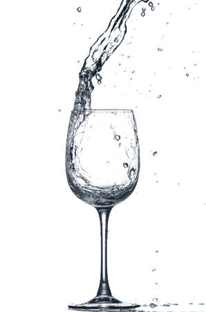 Glass of clean water with splash on white backgroundの写真素材