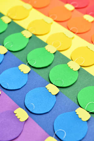 Creative rainbow Christmas balls on color background