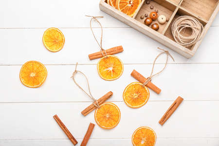 Handmade Christmas toys on white wooden backgroundの写真素材