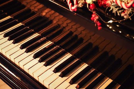 Black grand piano decorated for Christmas, closeupの写真素材