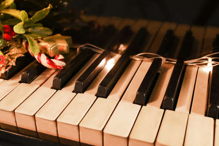 Piano keys with Christmas decor, closeupの写真素材