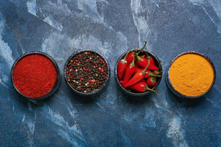 Set of aromatic spices on blue backgroundの写真素材