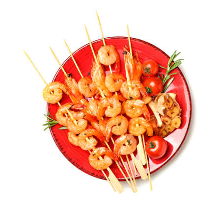 Plate with grilled shrimp skewers on white backgroundの写真素材