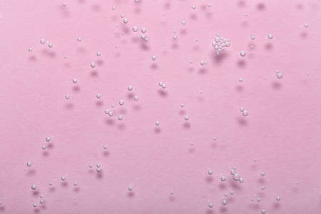 Water bubbles on pink background