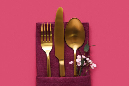 Stylish cutlery on pink backgroundの写真素材