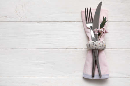 Stylish cutlery on light wooden backgroundの写真素材