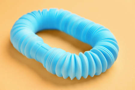 Blue Pop Tube on orange background, closeupの写真素材