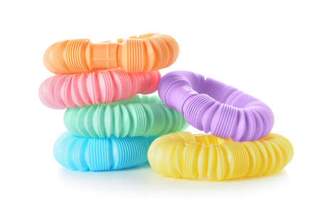 Different colorful Pop Tubes on white background