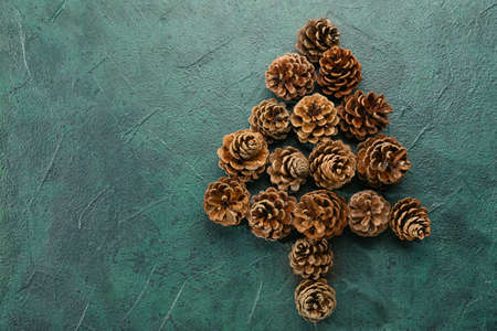 Tree made of pine cones on dark backgroundの写真素材
