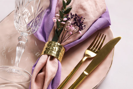 Festive table setting with flowers on light background, closeupの写真素材