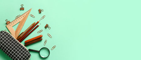 Pencil case and stationery on color background with space for text
