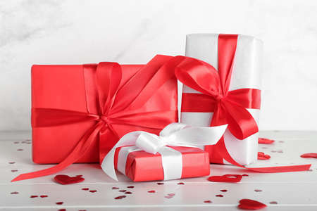 Gifts for Valentine's Day on light wooden background