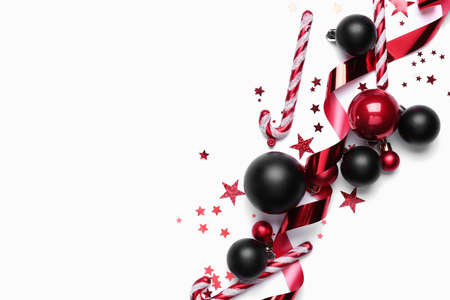 Beautiful Christmas composition with balls and candy canes on white backgroundの写真素材