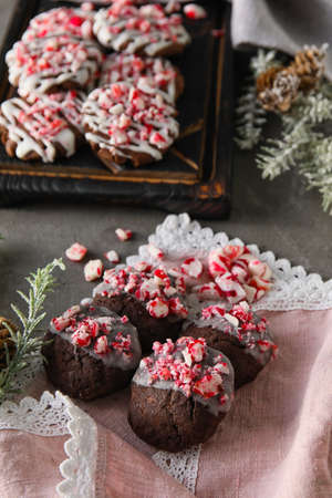 Tasty candy cane cookies on gray background
