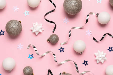 Beautiful Christmas composition with decor on pink background