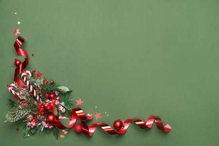 Beautiful Christmas composition with decor on green background