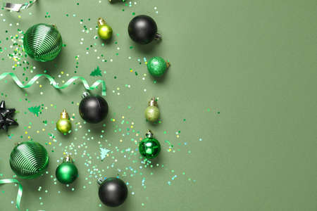 Beautiful Christmas composition with decor on green backgroundの写真素材