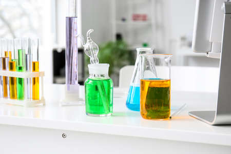 Chemical glassware on table in medical laboratoryの写真素材