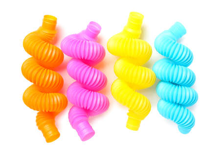 Different colorful Pop Tubes on white background