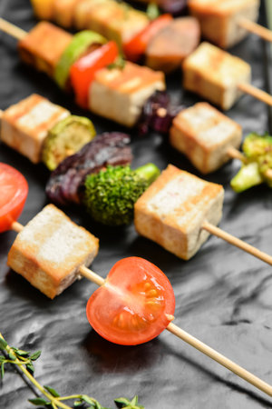 Plate with grilled tofu cheese skewers, closeupの写真素材