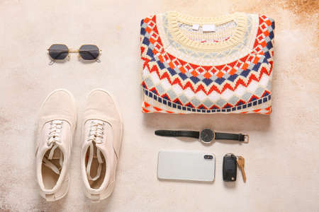 Male sweater, shoes, accessories and mobile phone on grunge backgroundの写真素材