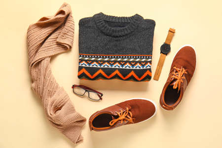 Warm male sweater, accessories and shoes on color backgroundの写真素材