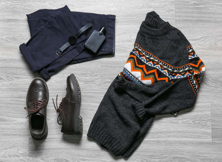 Stylish male clothes, leather shoes and accessories on wooden backgroundの写真素材