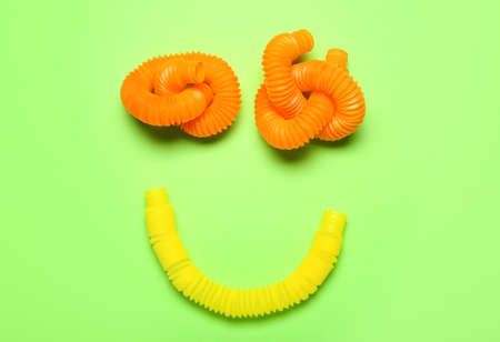Smile made of Pop Tubes on green backgroundの写真素材