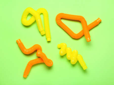 Pop Tubes on green background