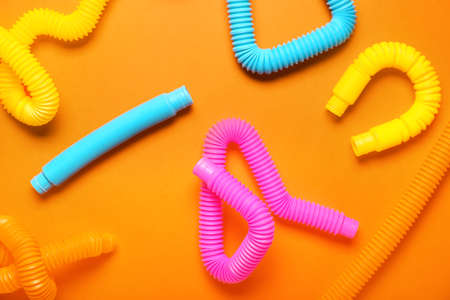 Pop Tubes on orange background