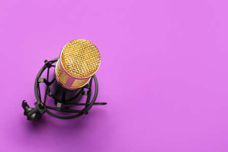 Modern microphone with stand on purple background, closeupの写真素材
