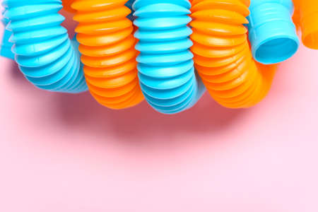 Pop Tubes on pink background, closeupの写真素材