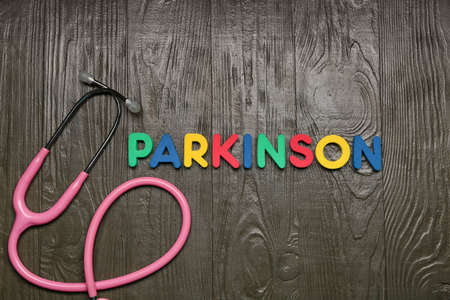Word PARKINSON with stethoscope on wooden backgroundの写真素材