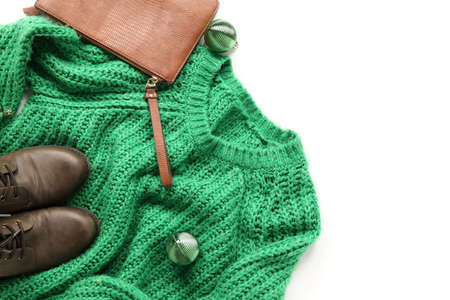 Stylish sweater, bag, shoes and Christmas balls on white background, closeupの写真素材