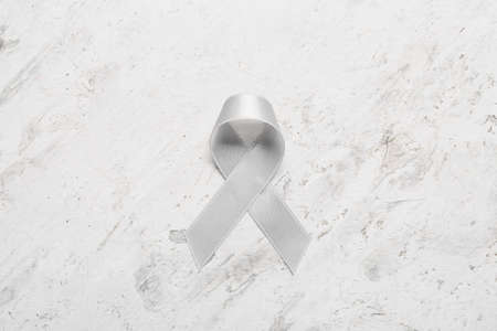 Parkinson's awareness ribbon on light backgroundの写真素材