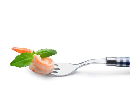 Fork with tasty boiled shrimp tail on white backgroundの写真素材