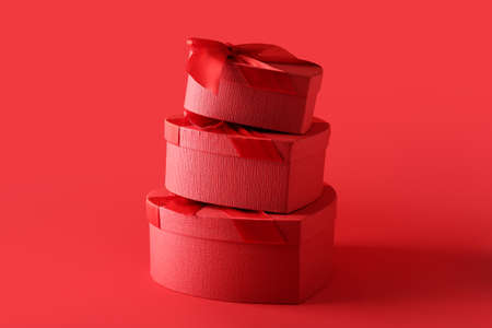 Gift boxes for Valentine's Day on red background