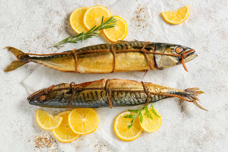 Smoked mackerel fishes on light background