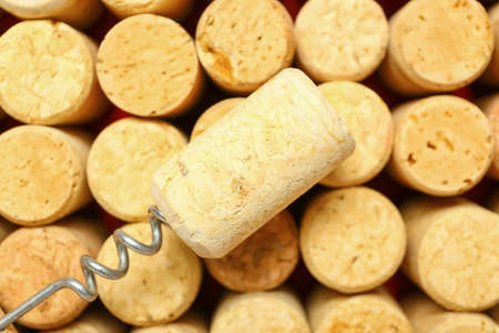 Texture of wine corks and opener as background