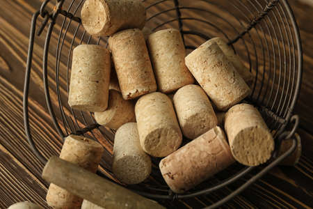 Basket with wine corks on wooden backgroundの写真素材