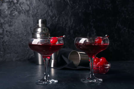 Glasses of tasty Manhattan cocktail on black backgroundの写真素材