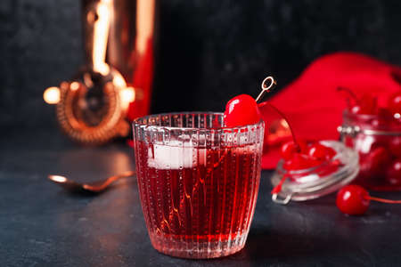 Glass of tasty Manhattan cocktail on black backgroundの写真素材