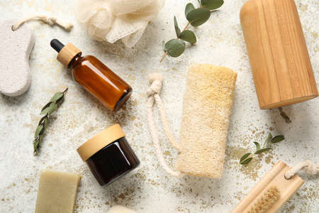 Composition with cosmetics, bath supplies and eucalyptus branches on light backgroundの写真素材