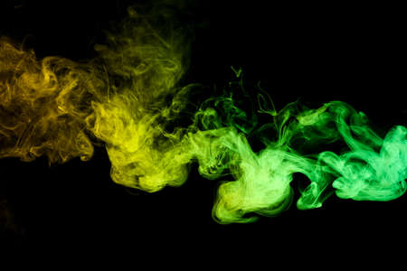 color smoke on black backgroundの写真素材