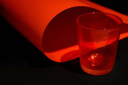 Stylish empty glass on dark background, closeup