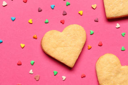 Tasty heart shaped cookies on pink background. valentine's day celebrationの写真素材